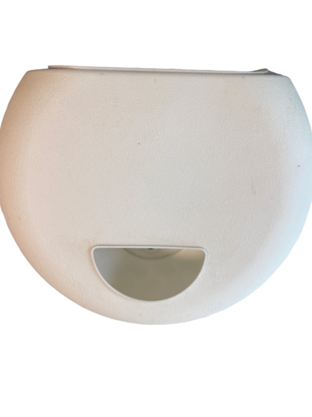 white wall-mounted dispenser used to store and organize grocery bags